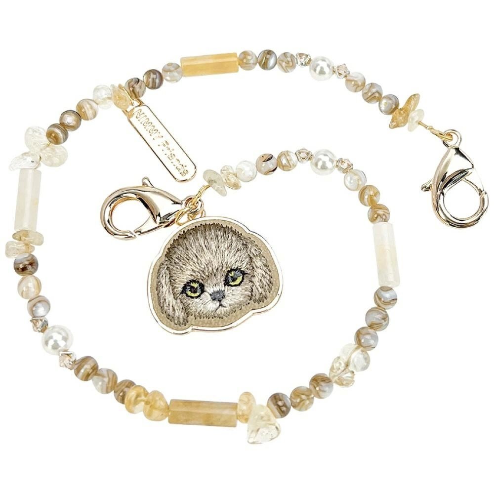 Magnetinis rankenos pakabukas Nimmy Handstrap Bag Charm – rudas 2 Magnetinis rankenos pakabukas Nimmy Handstrap Bag Charm – rudas 2